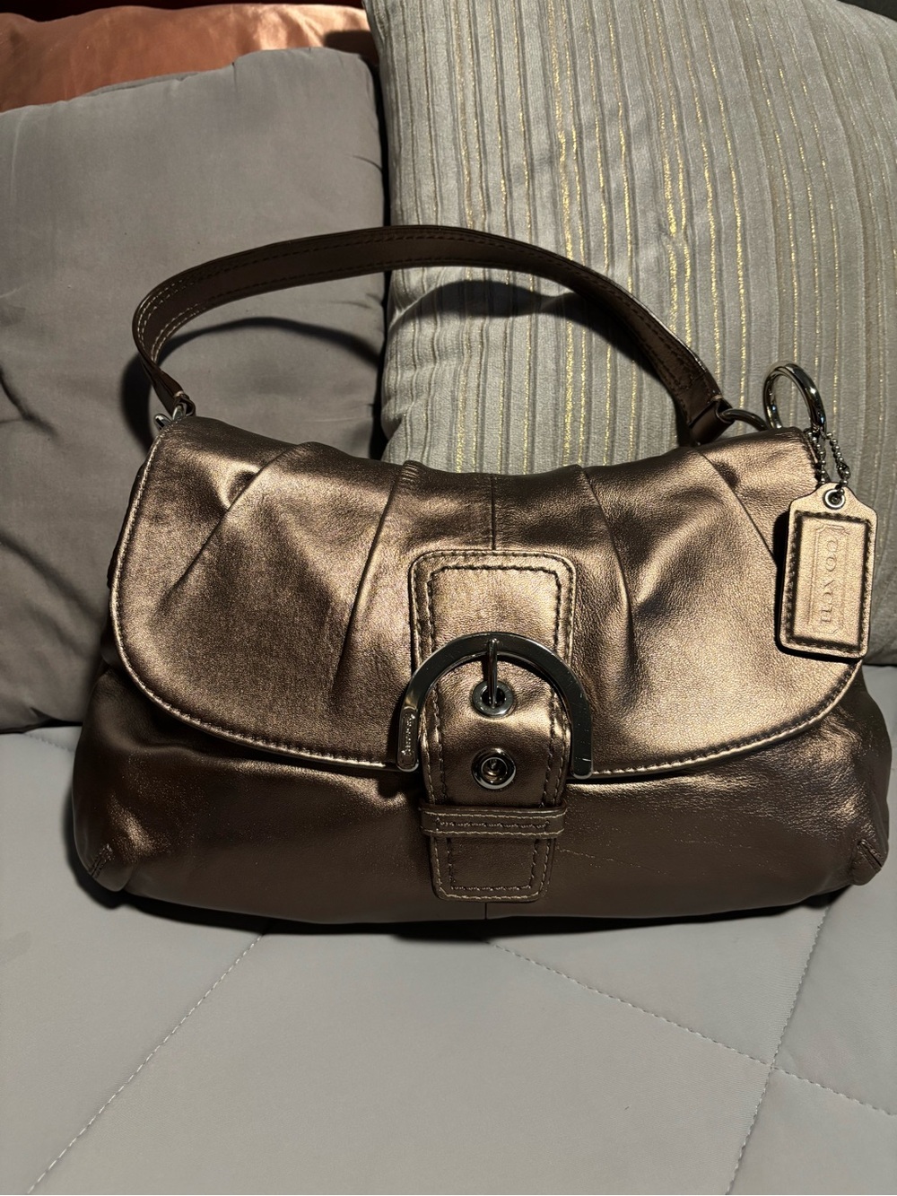 This is a vintage Coach SoHo buckle purse and matching wallet in metallic bronze